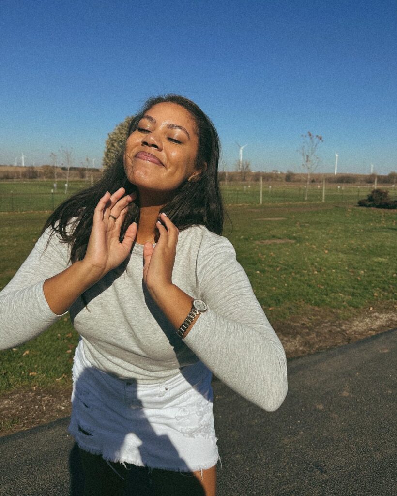 Smiling outside.